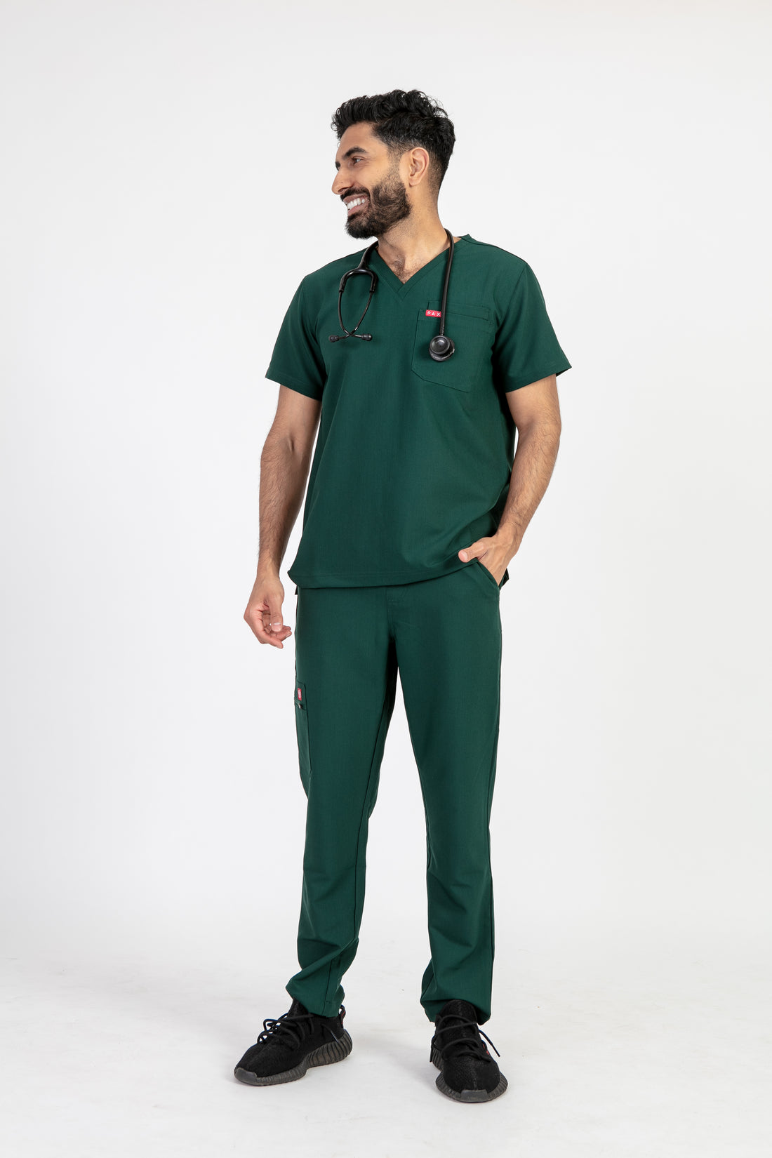 PAX Sequi men's forest green scrub top, full-length front view