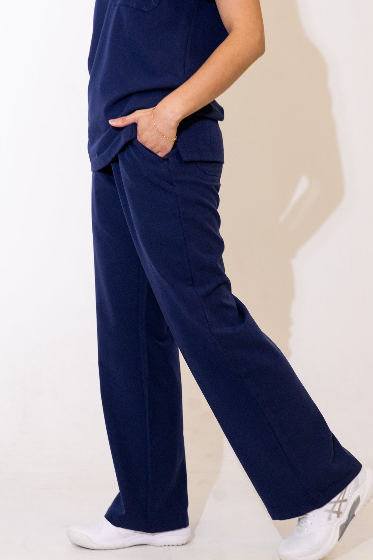 PAX Core Luma women's navy wide-leg scrub trousers, hip pocket and wide-leg fit in movement