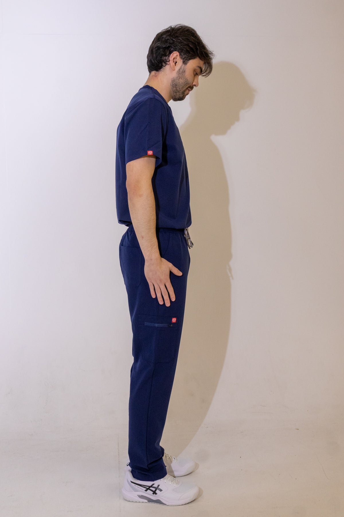 PAX Core Sequi men's navy straight-leg scrub trousers, full-length side view