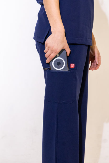 PAX Core Luma women's navy wide-leg scrub trousers, cargo pocket detail with a device