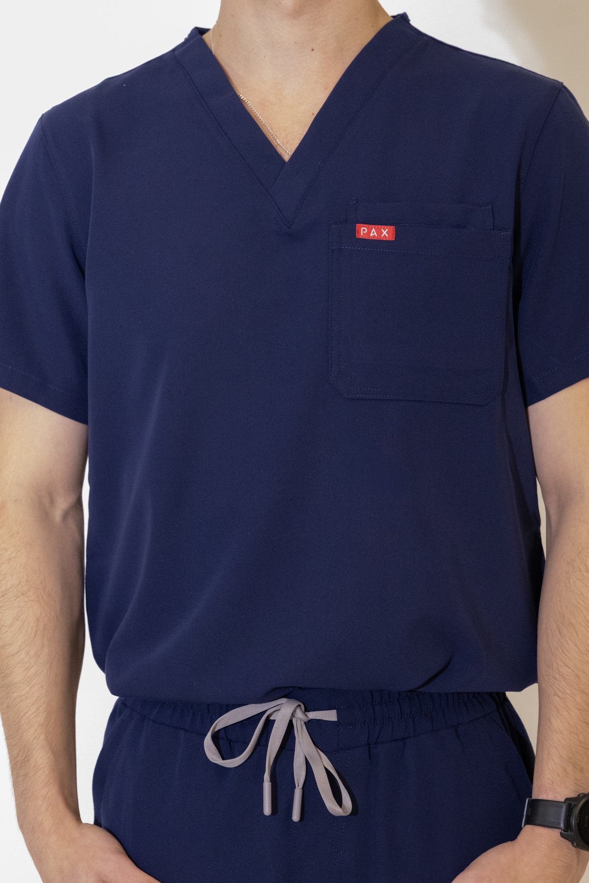 PAX Core Sequi men's navy straight-leg scrub set, V-neck, chest pocket and drawstring waist detail
