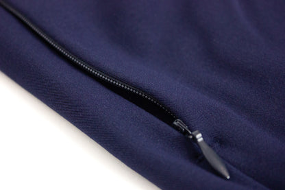 Close-up of an invisible zipper pocket on royal blue PAX medical scrub bottoms.