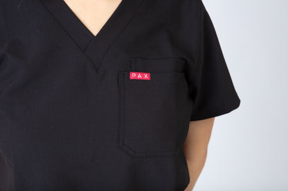 Black scrub top with a red 'PAX' logo on the chest pocket against a white background