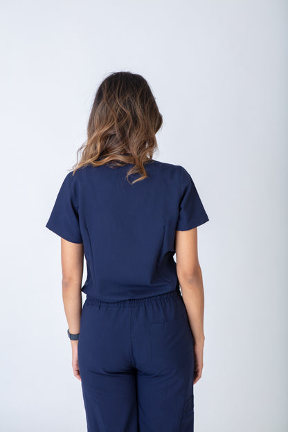 Person wearing a navy blue outfit against a white background