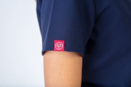 Navy blue shirt with a red logo on the sleeve against a white background