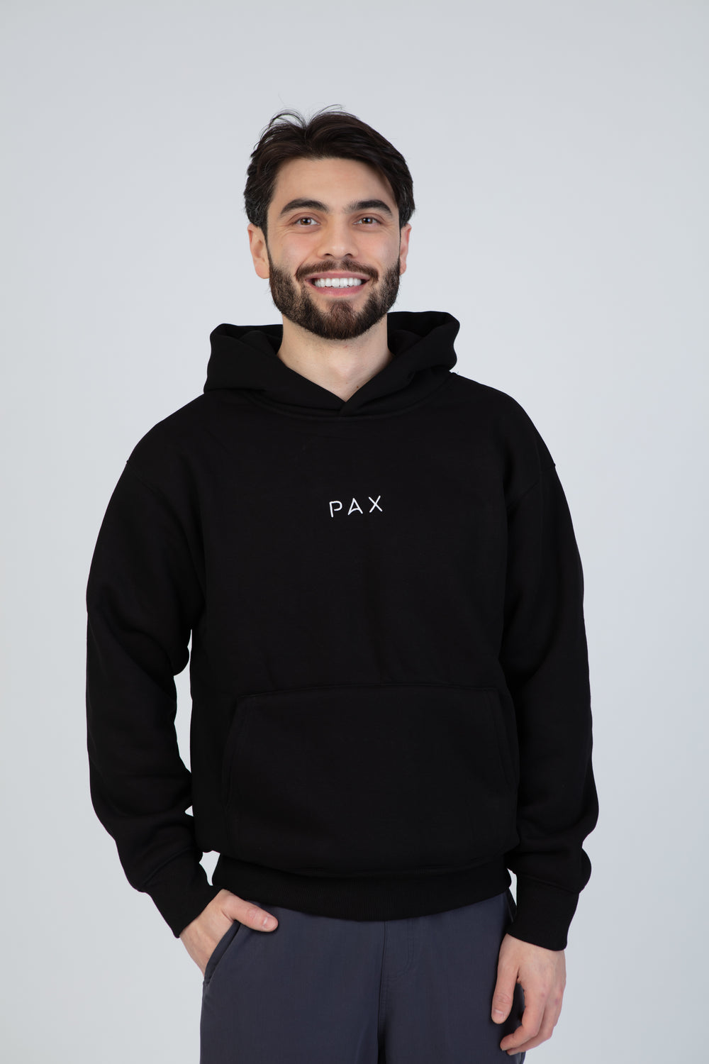 PAX Everywhere black hoodie, front view on model