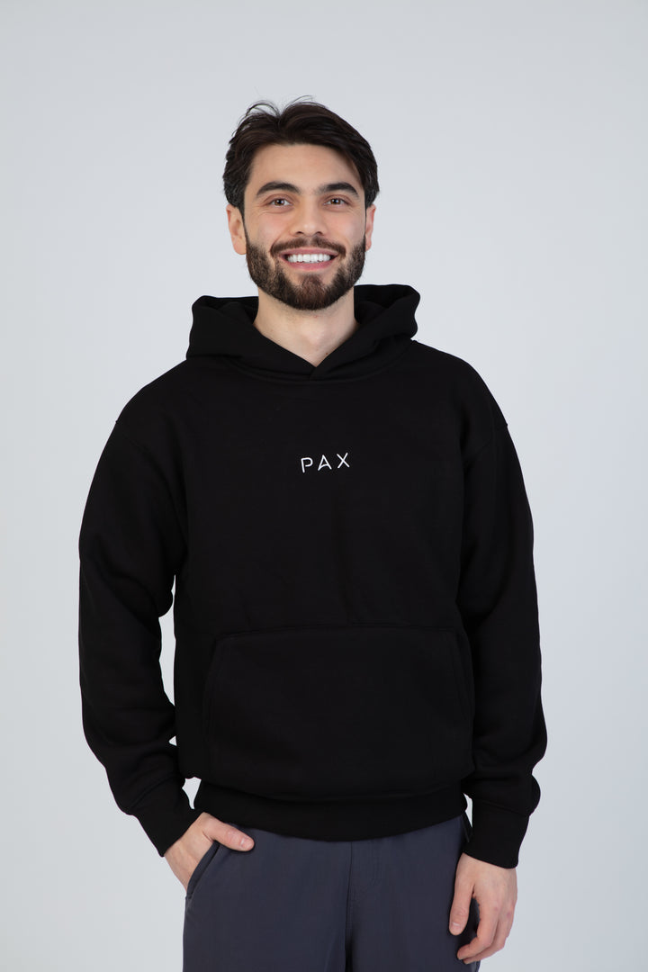 PAX Everywhere black hoodie, front view on model